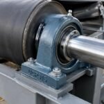 UCP315 pillow block bearing mounted on a conveyor drive shaft
